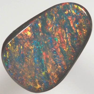 SOLID BLACK OPAL Bands of red and orange over turquoise blue
